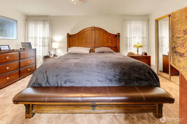 a bedroom with a bed and window