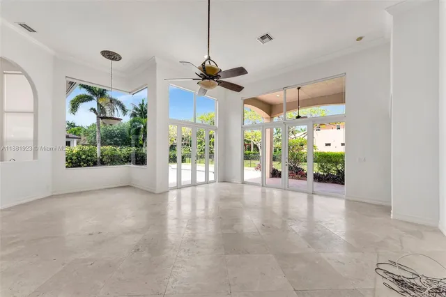 a view of a livingroom with furniture window and front door