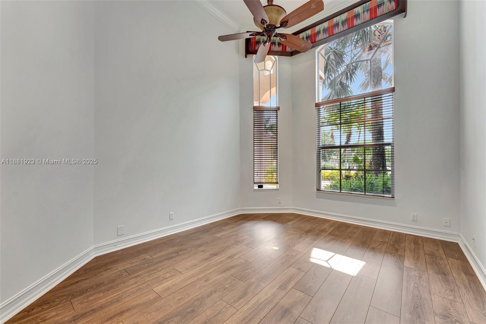3203 West Stonebrook Circle Davie, FL 33330 - Photo 31 of 51 a view of empty room with wooden floor and fan