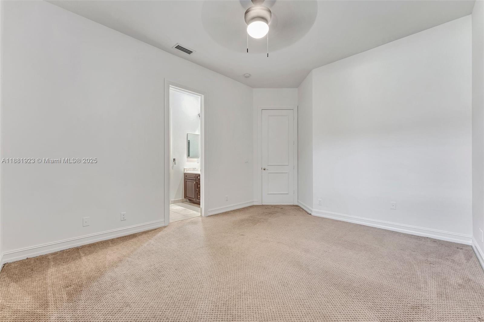 3203 West Stonebrook Circle Davie, FL 33330 - Photo 32 of 51 an empty room with an entryway and closet area