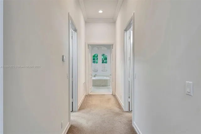 an empty room with a window and a ceiling fan