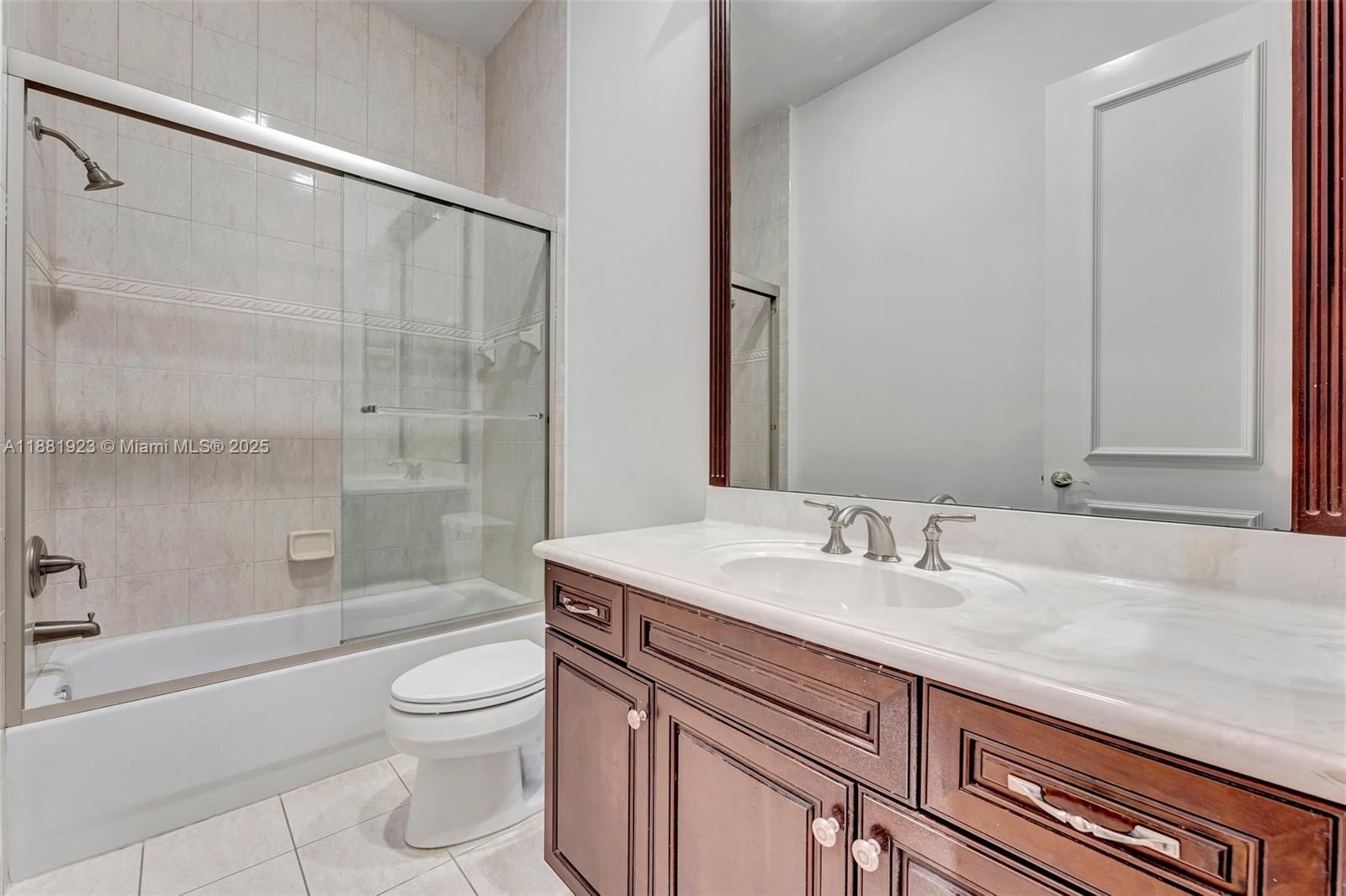 3203 West Stonebrook Circle Davie, FL 33330 - Photo 38 of 51 a bathroom with a sink a toilet and shower