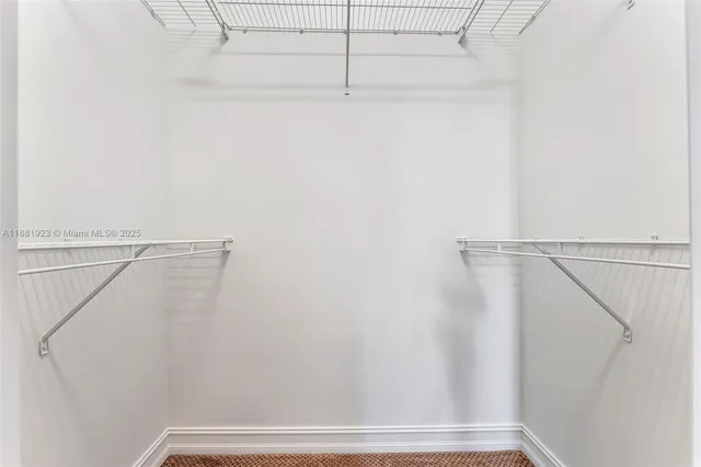 a bathroom with a sink mirror and toilet