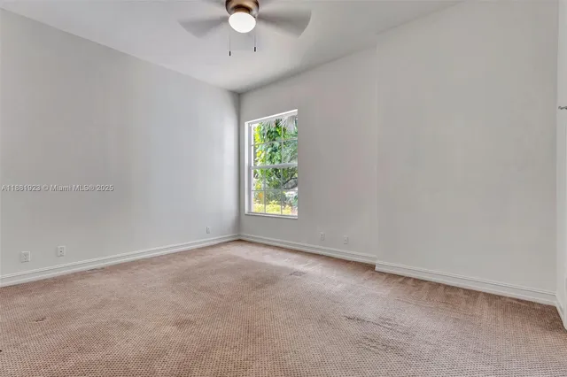 a white toilet sitting next to a shower