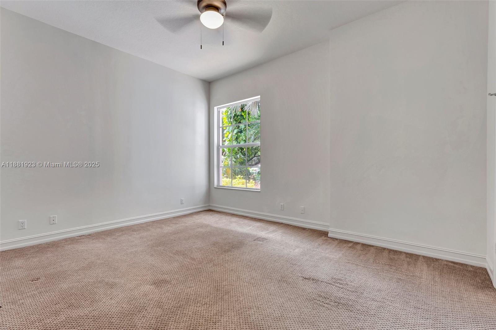 3203 West Stonebrook Circle Davie, FL 33330 - Photo 42 of 51 an empty room with a window