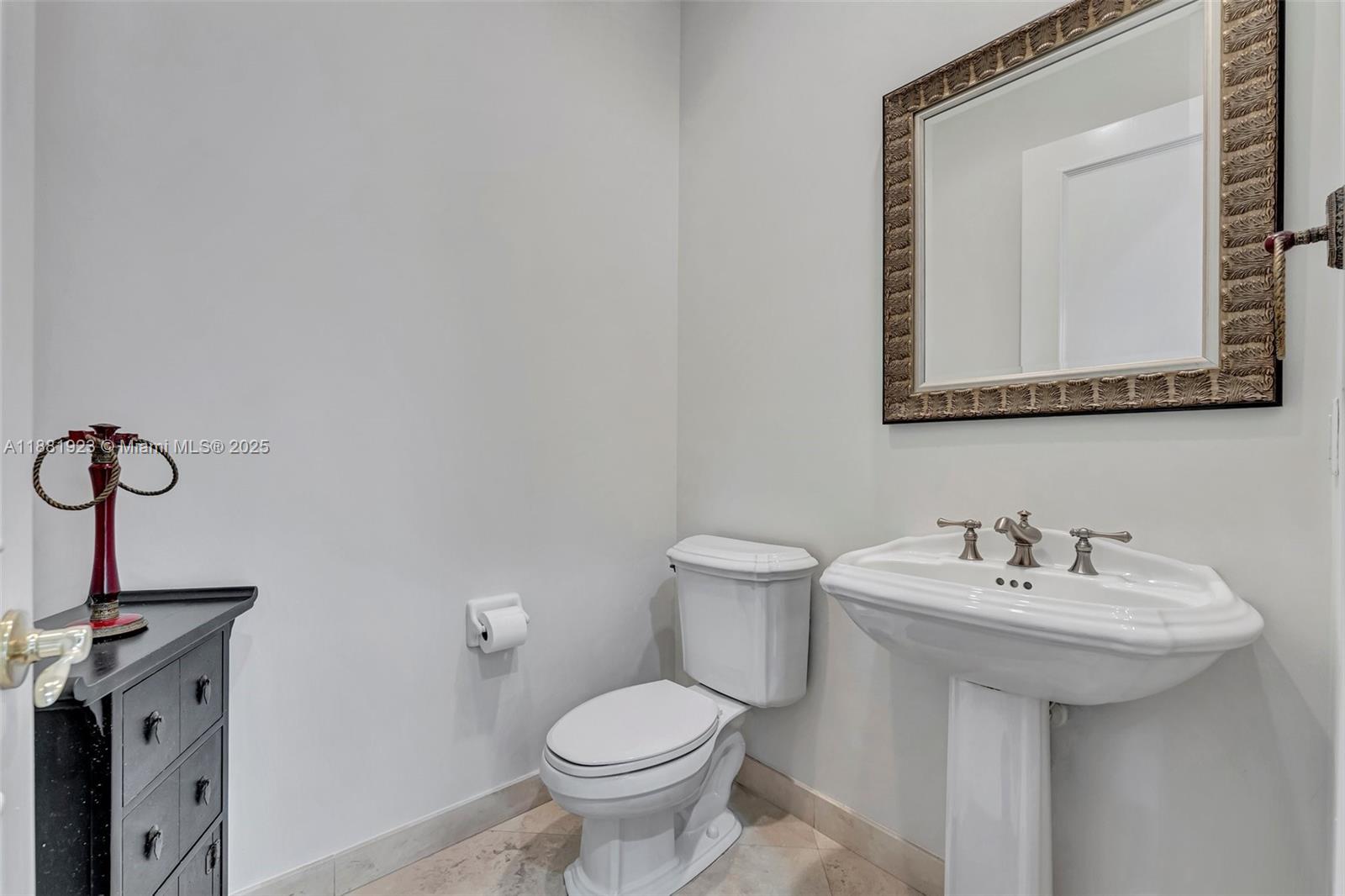 3203 West Stonebrook Circle Davie, FL 33330 - Photo 43 of 51 a bathroom with a sink mirror and toilet