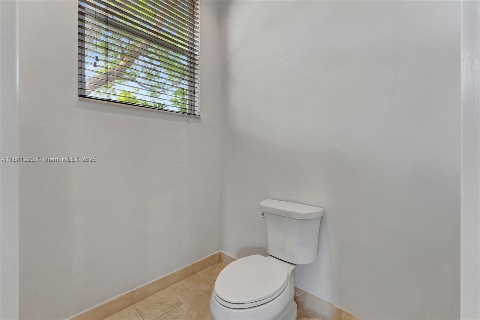 3203 West Stonebrook Circle Davie, FL 33330 - Photo 44 of 51 a white toilet sitting next to a shower