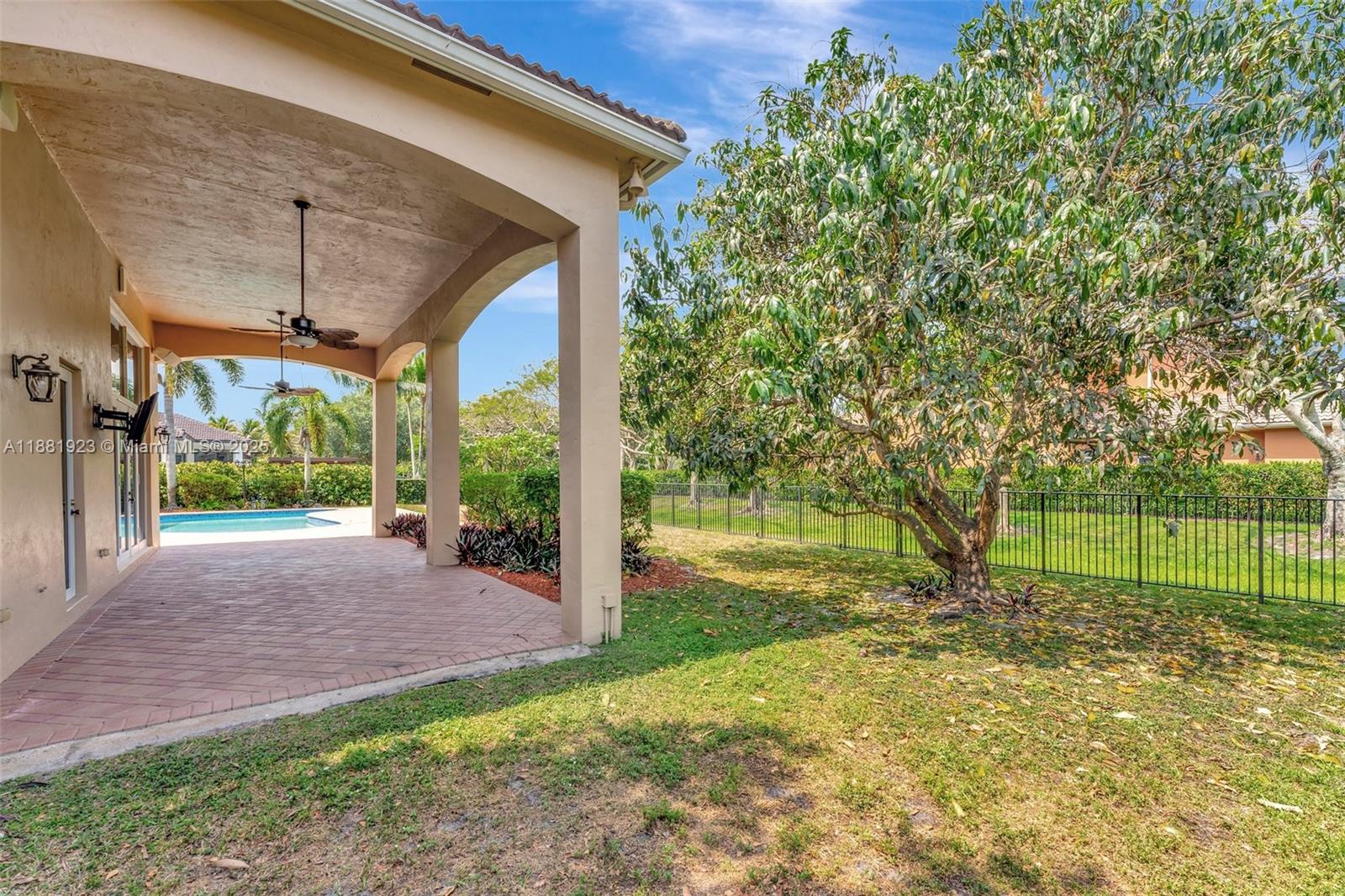 3203 West Stonebrook Circle Davie, FL 33330 - Photo 48 of 51 a view of a yard with a tree