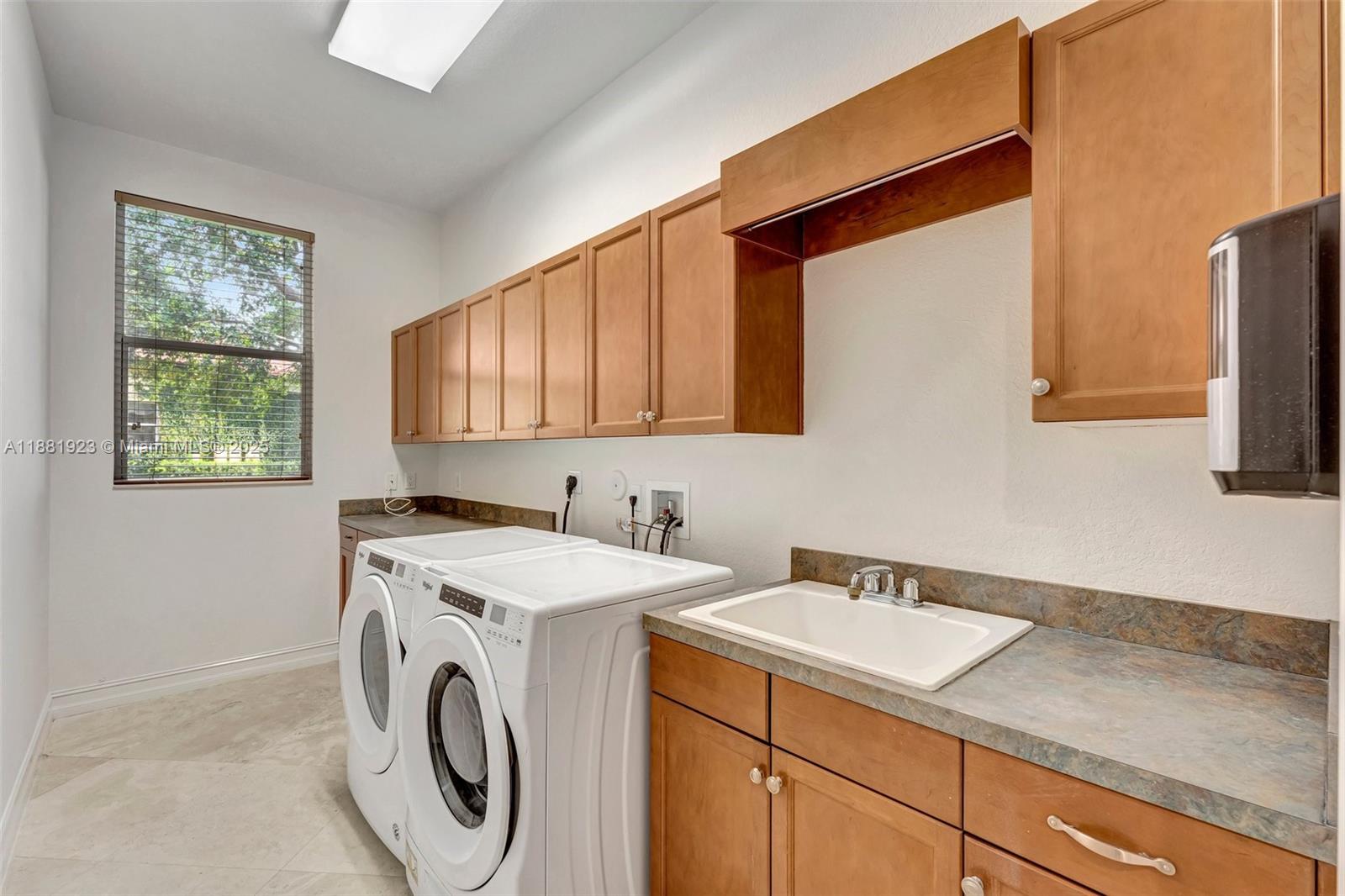 3203 West Stonebrook Circle Davie, FL 33330 - Photo 49 of 51 a utility room with dryer and washer