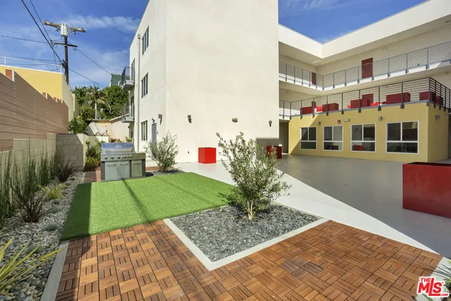 a view of multiple houses with a yard