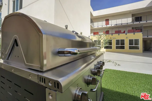 a view of an chairs and table in the balcony