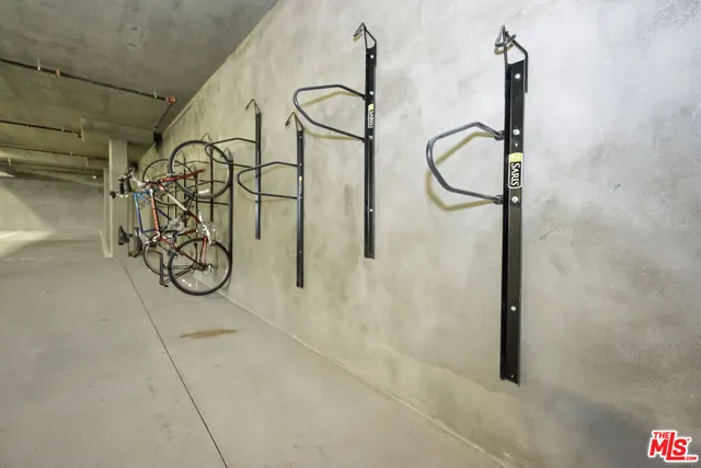 a bathroom with a granite countertop shower a mirror and a sink