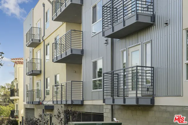 a city street lined with tall buildings and a walk in closet