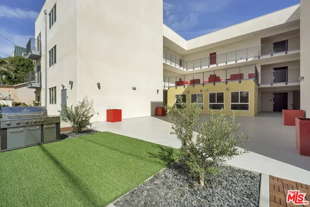 a front view of building with yard