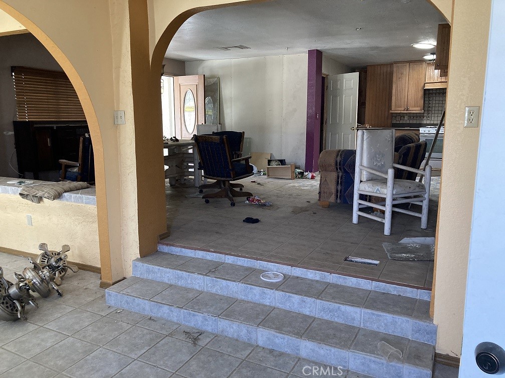 30546 Sutter Road Lucerne Valley, CA 92356 - Photo 1 of 1 a view of a livingroom with furniture and a flat screen tv