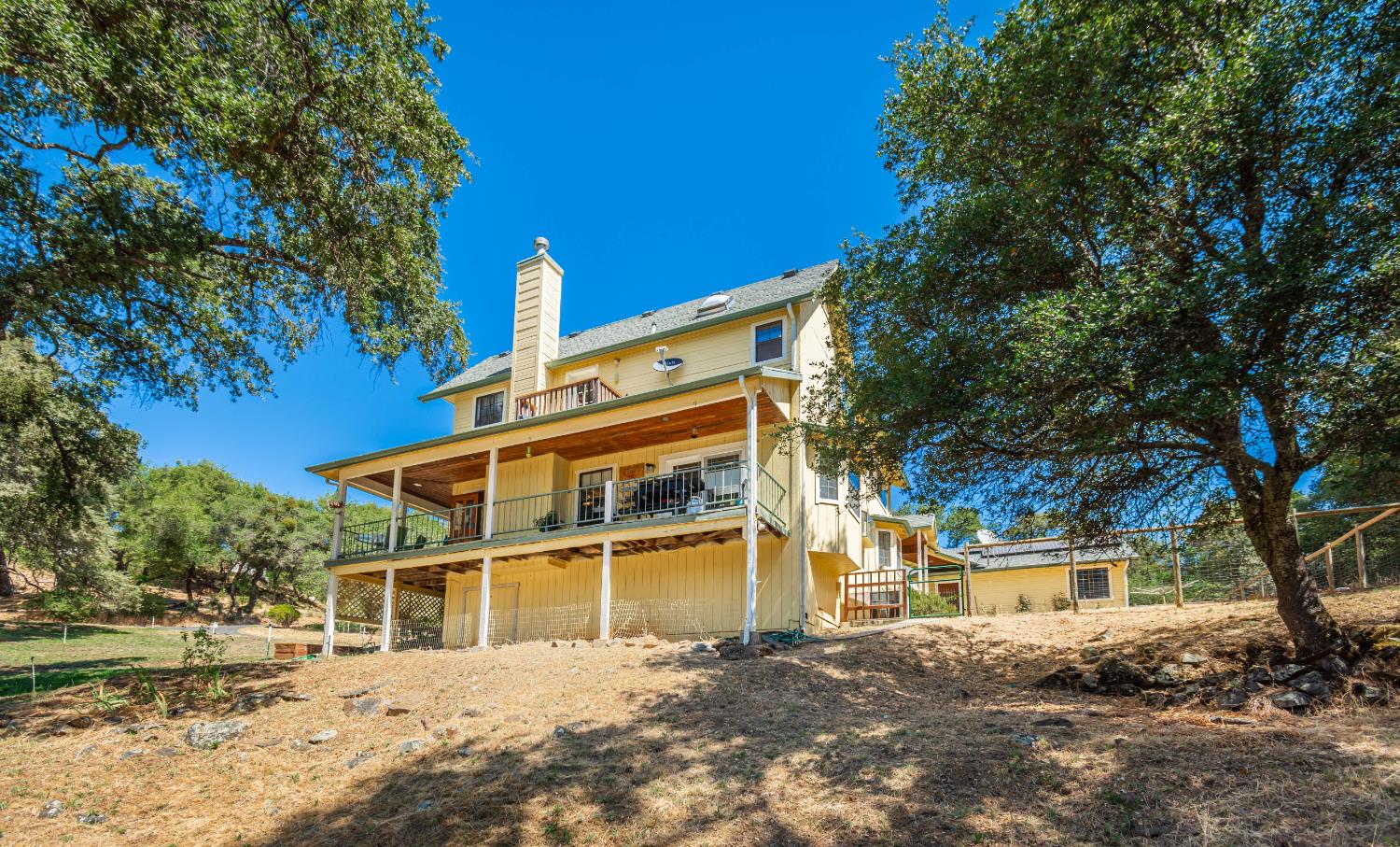10151 Trauner Road Rough and Ready, CA 95975 - Photo 12 of 45 a front view of a house with a yard