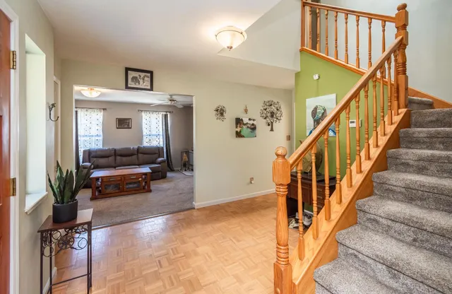 a view of entryway and hall with dining room