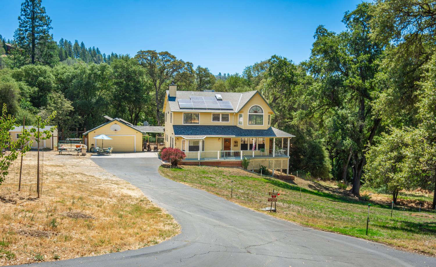 10151 Trauner Road Rough and Ready, CA 95975 - Photo 2 of 45 a front view of a house with garden