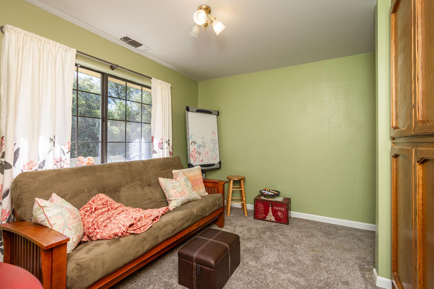 10151 Trauner Road Rough and Ready, CA 95975 - Photo 24 of 45 a living room with furniture and a window