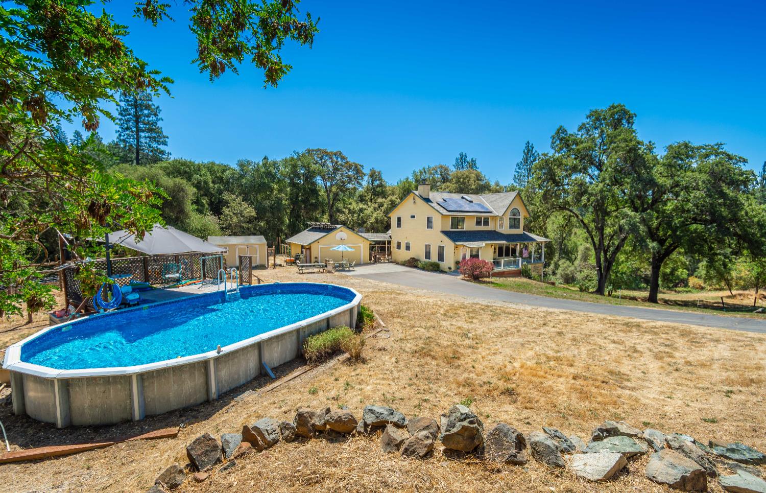 10151 Trauner Road Rough and Ready, CA 95975 - Photo 40 of 45 a swimming pool with outdoor seating and yard