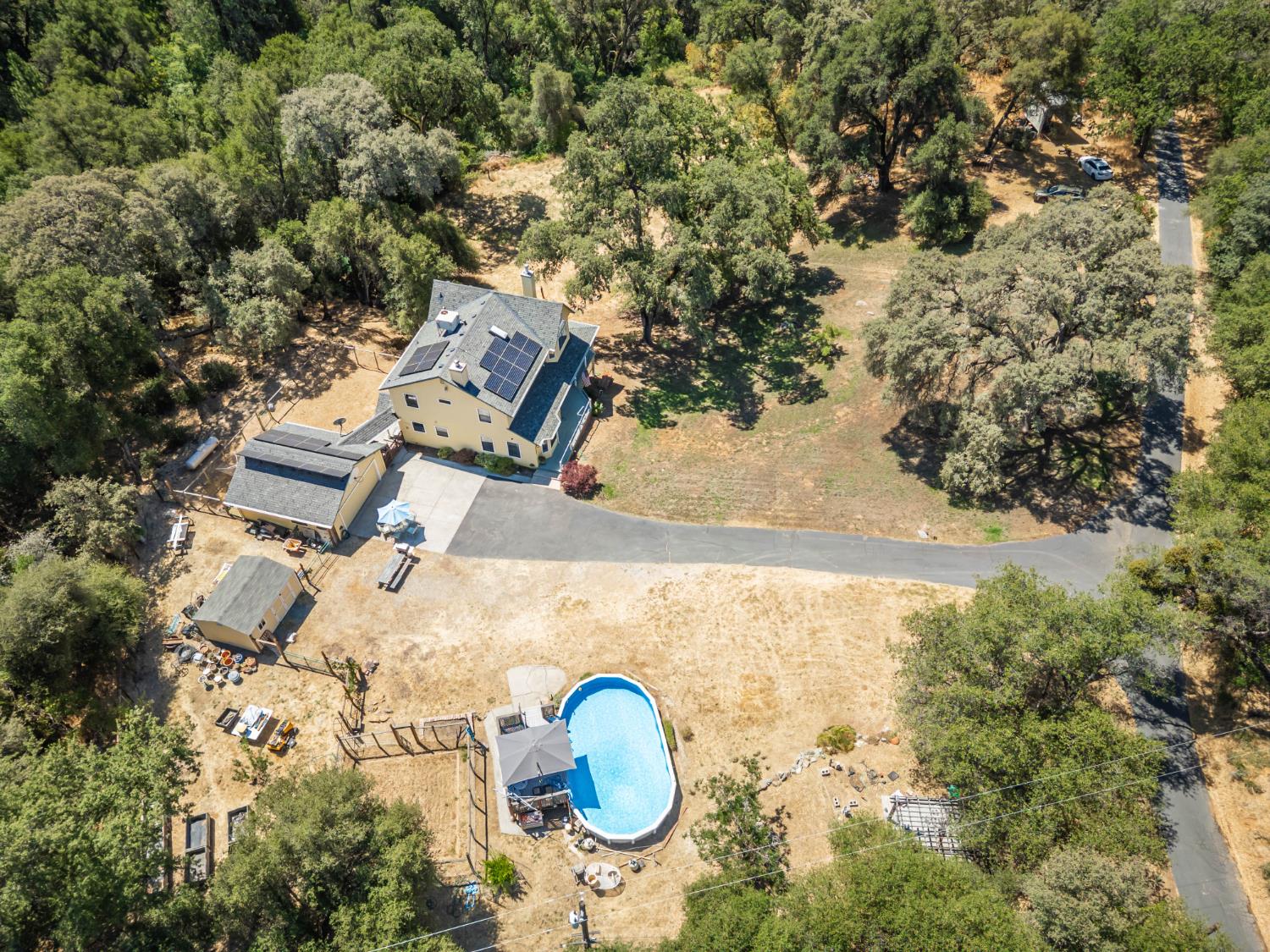 10151 Trauner Road Rough and Ready, CA 95975 - Photo 43 of 45 an aerial view of a house with backyard space and garden
