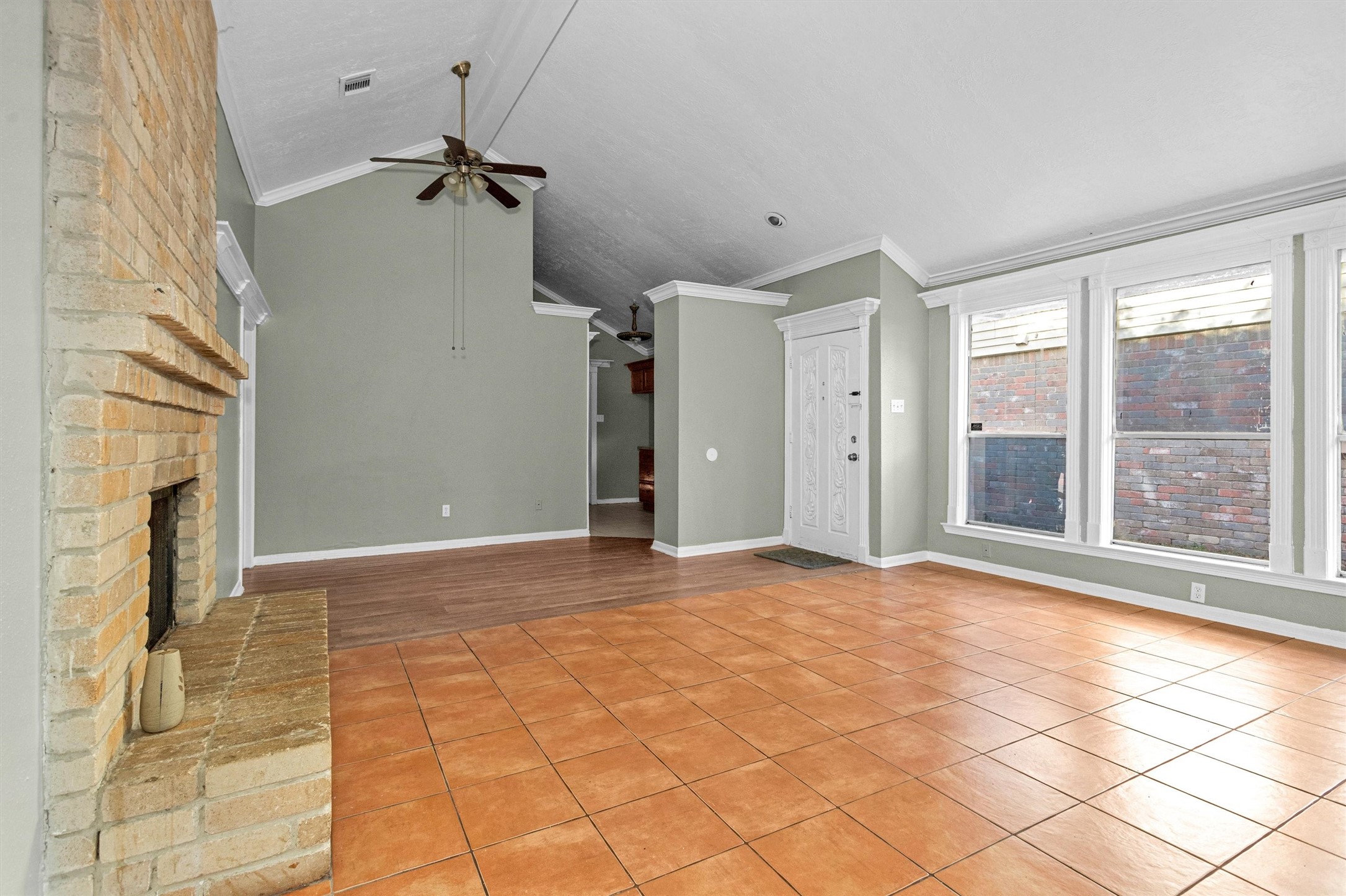 12443 South Rachlin Circle Houston, TX 77071 - Photo 8 of 29 a view of an empty room with a fireplace and a window