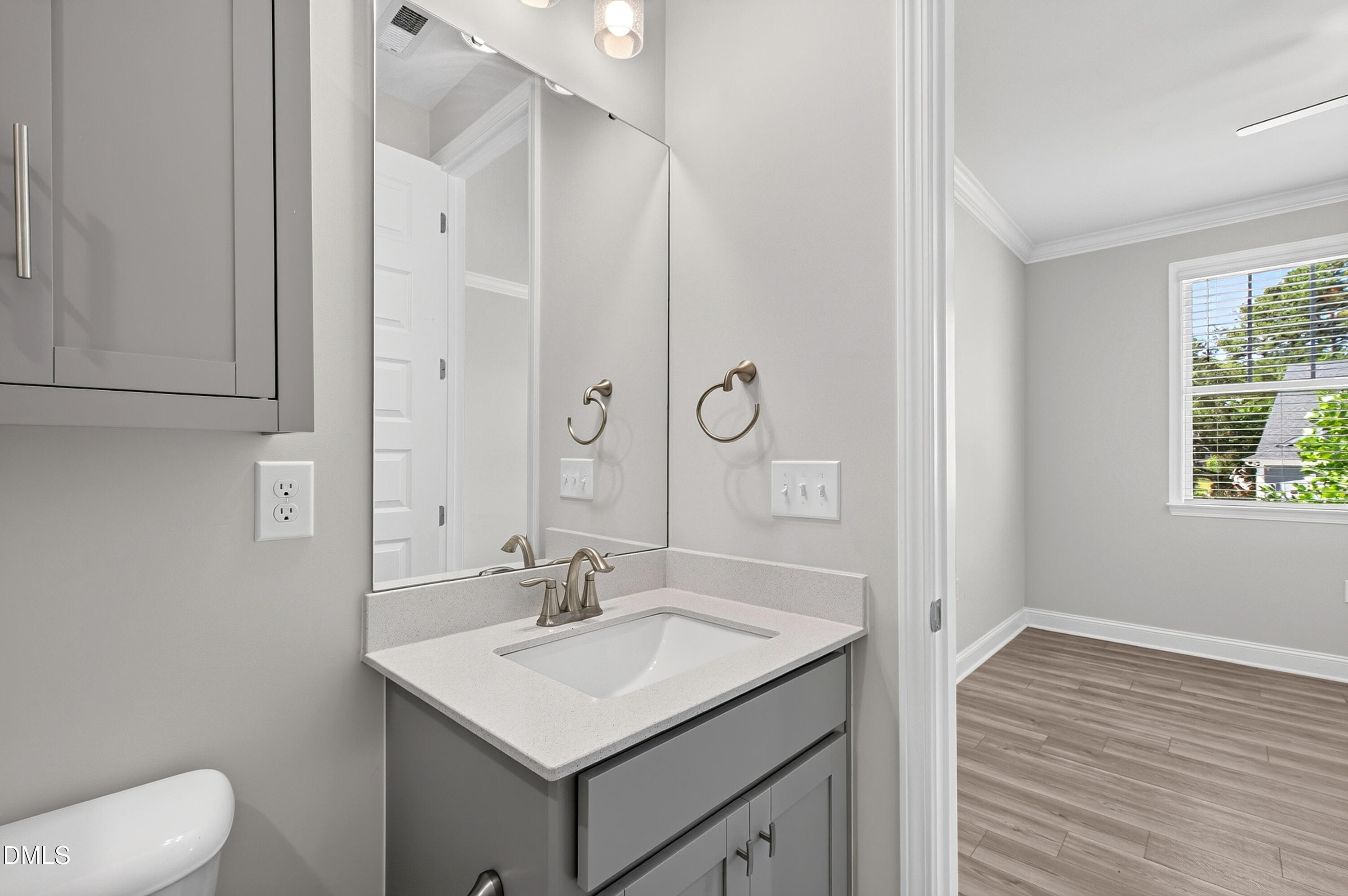 1300 Commons Ford Place Apex, NC 27539 - Photo 41 of 70 a bathroom with a sink toilet and vanity
