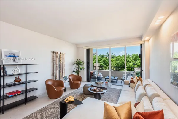 a living room with furniture and a window