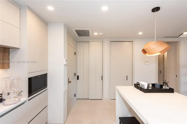 a kitchen with a sink a stove and a refrigerator