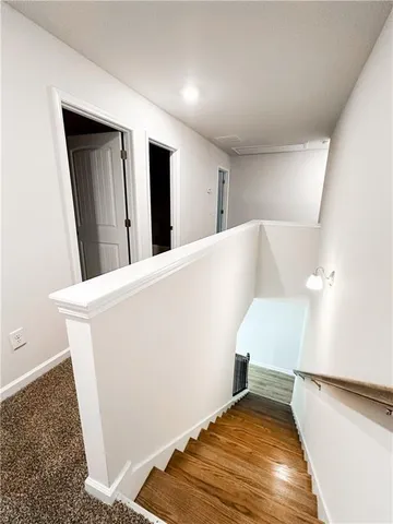 a view of a hallway with staircase