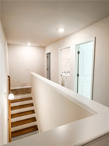 a view of a hallway with staircase