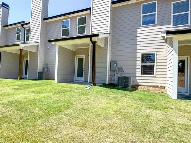 a view of a backyard of the house
