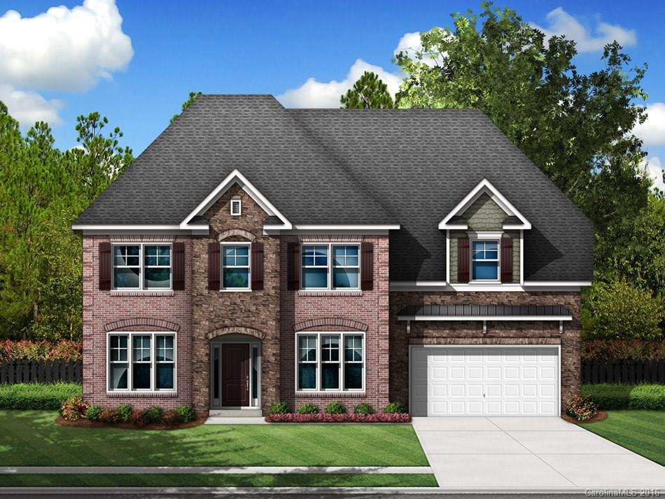 4921 River Oaks Road, Unit 114 Clover, SC 29710 - Photo 1 of 1 a front view of a house with a yard and garage