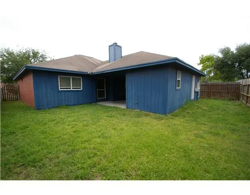 a house view with a backyard space