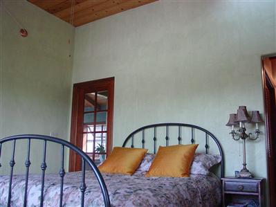 8380 Germone Road Sebastopol, CA 95472 - Photo 6 of 11 a blue bed sitting in a bedroom next to a window