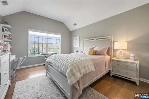 a bed room with a bed and a window