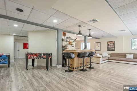 a view of a room with lots of furniture and wooden floor
