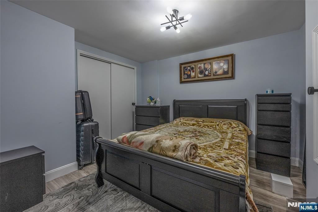 18 Renshaw Drive Montville, NJ 07045 - Photo 35 of 46 a bedroom with a bed and a chandelier