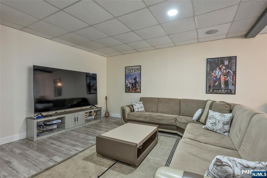 18 Renshaw Drive Montville, NJ 07045 - Photo 36 of 46 a living room with furniture and a flat screen tv