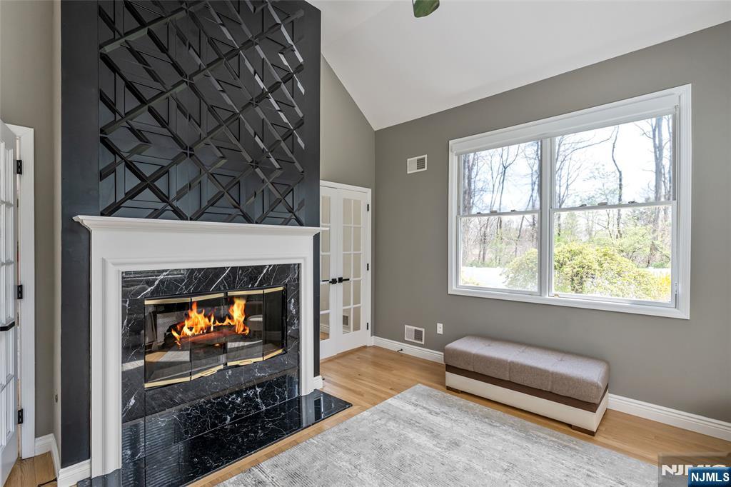 18 Renshaw Drive Montville, NJ 07045 - Photo 10 of 46 a living room with furniture and a fireplace