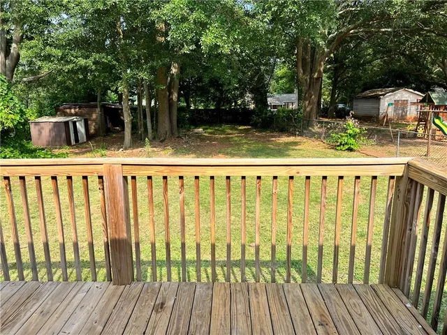 a view of outdoor space with deck and garden
