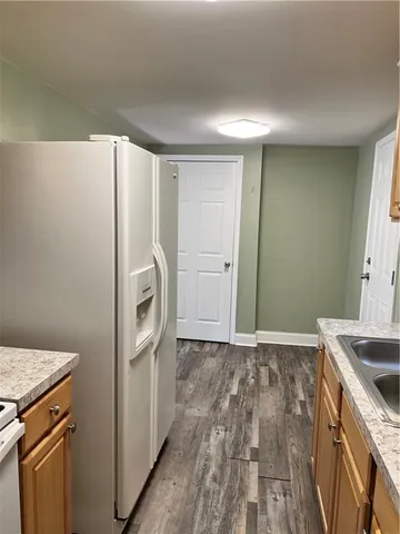 a kitchen with a refrigerator sink and washer