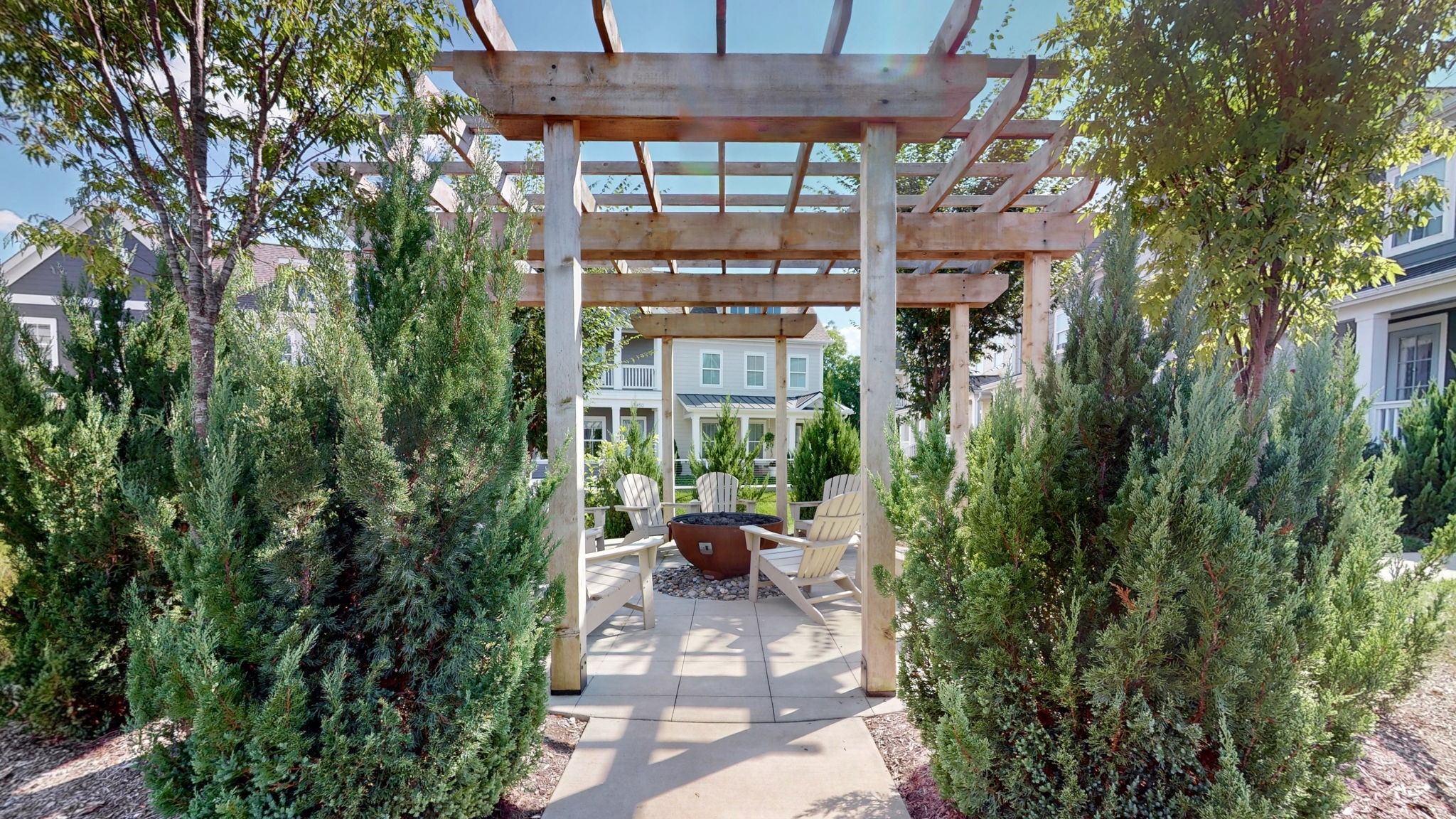 409 Herringbone Court Franklin, TN 37064 - Photo 33 of 36 a view of a patio with couches and table and chairs under an umbrella