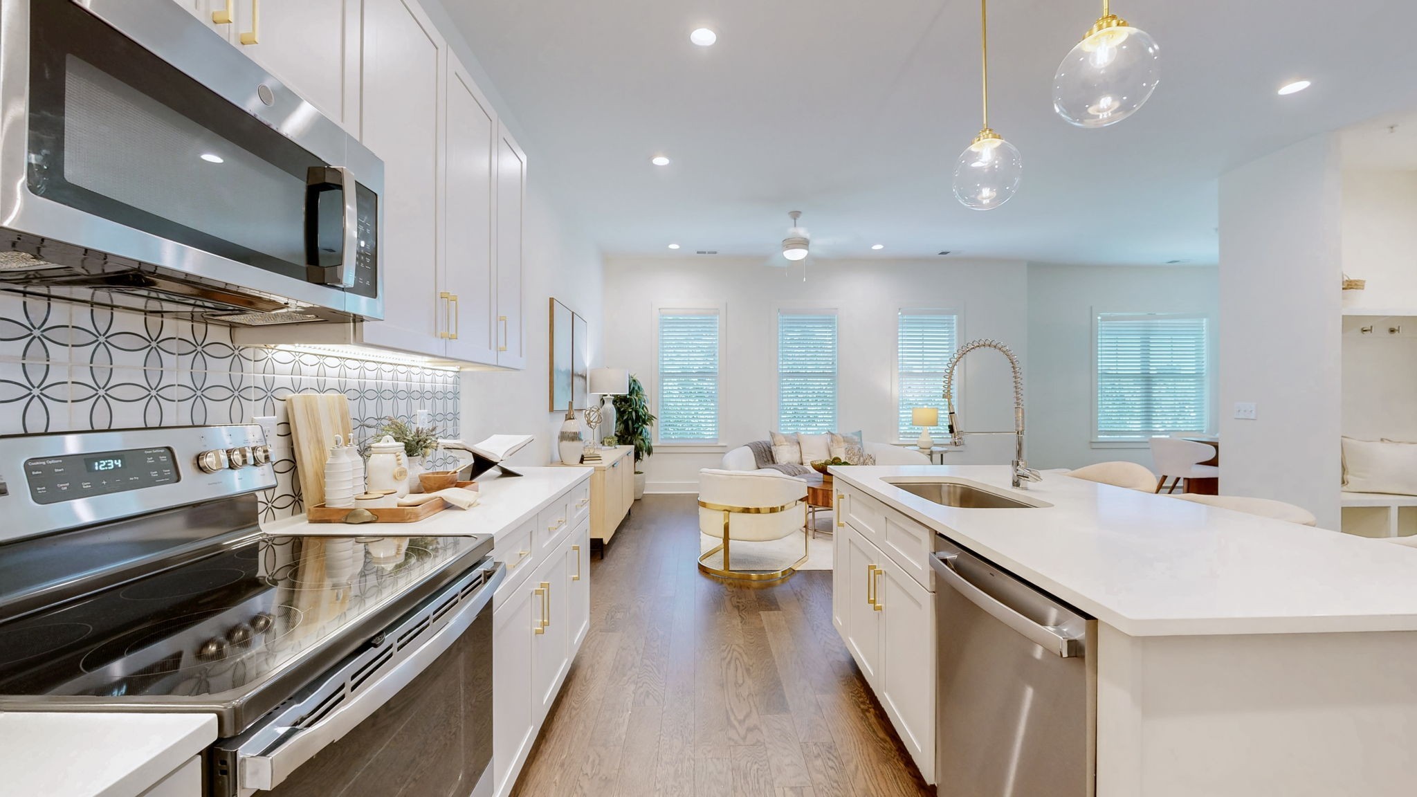 409 Herringbone Court Franklin, TN 37064 - Photo 6 of 36 a kitchen with a sink a stove and cabinets
