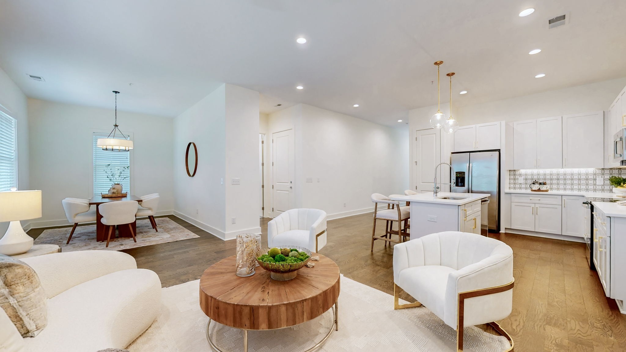 409 Herringbone Court Franklin, TN 37064 - Photo 8 of 36 a living room with kitchen island furniture and a view of kitchen
