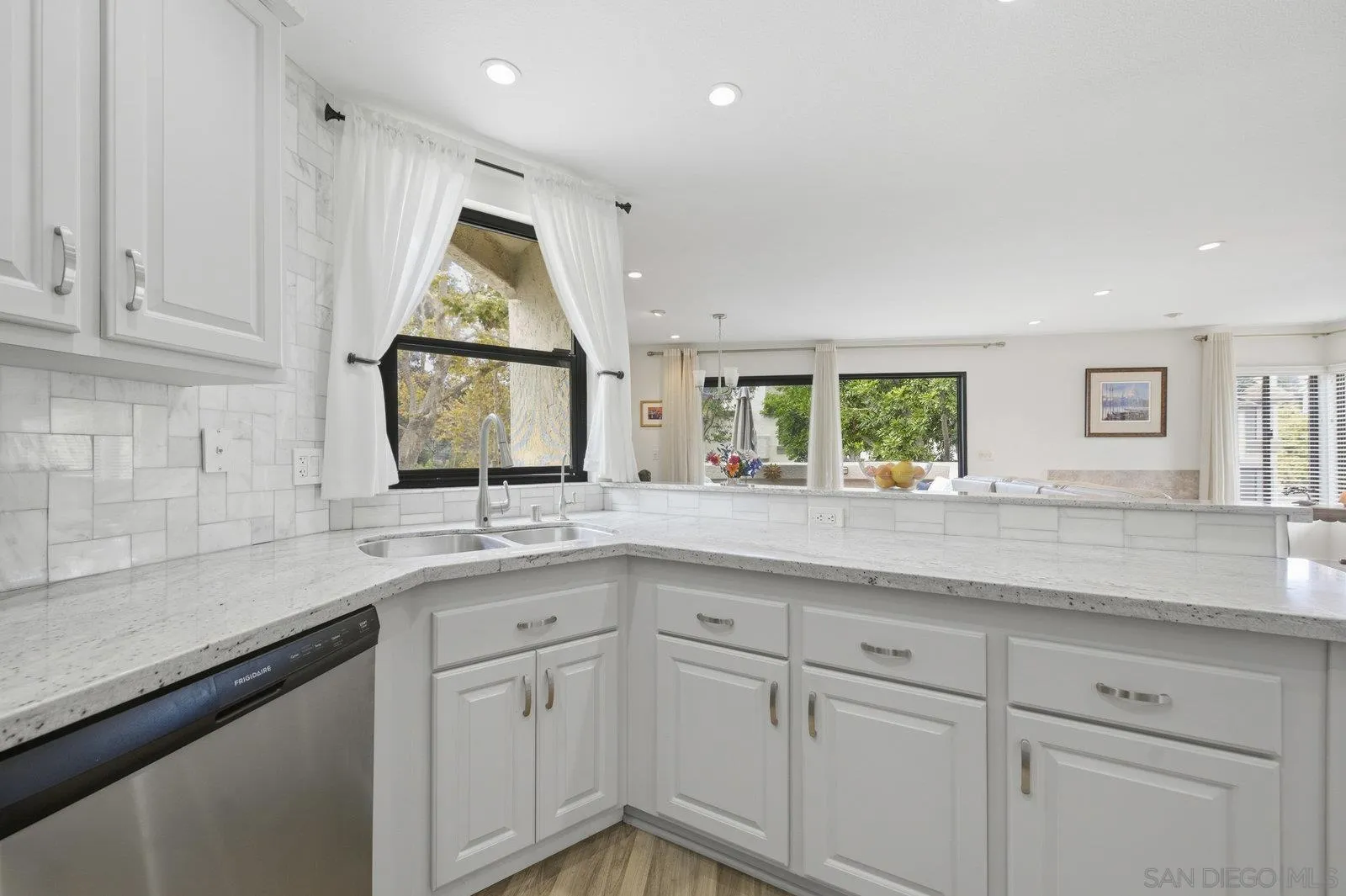 2742 Ariane Drive, Unit 153 San Diego, CA 92117 - Photo 14 of 43 a kitchen with a sink and cabinets