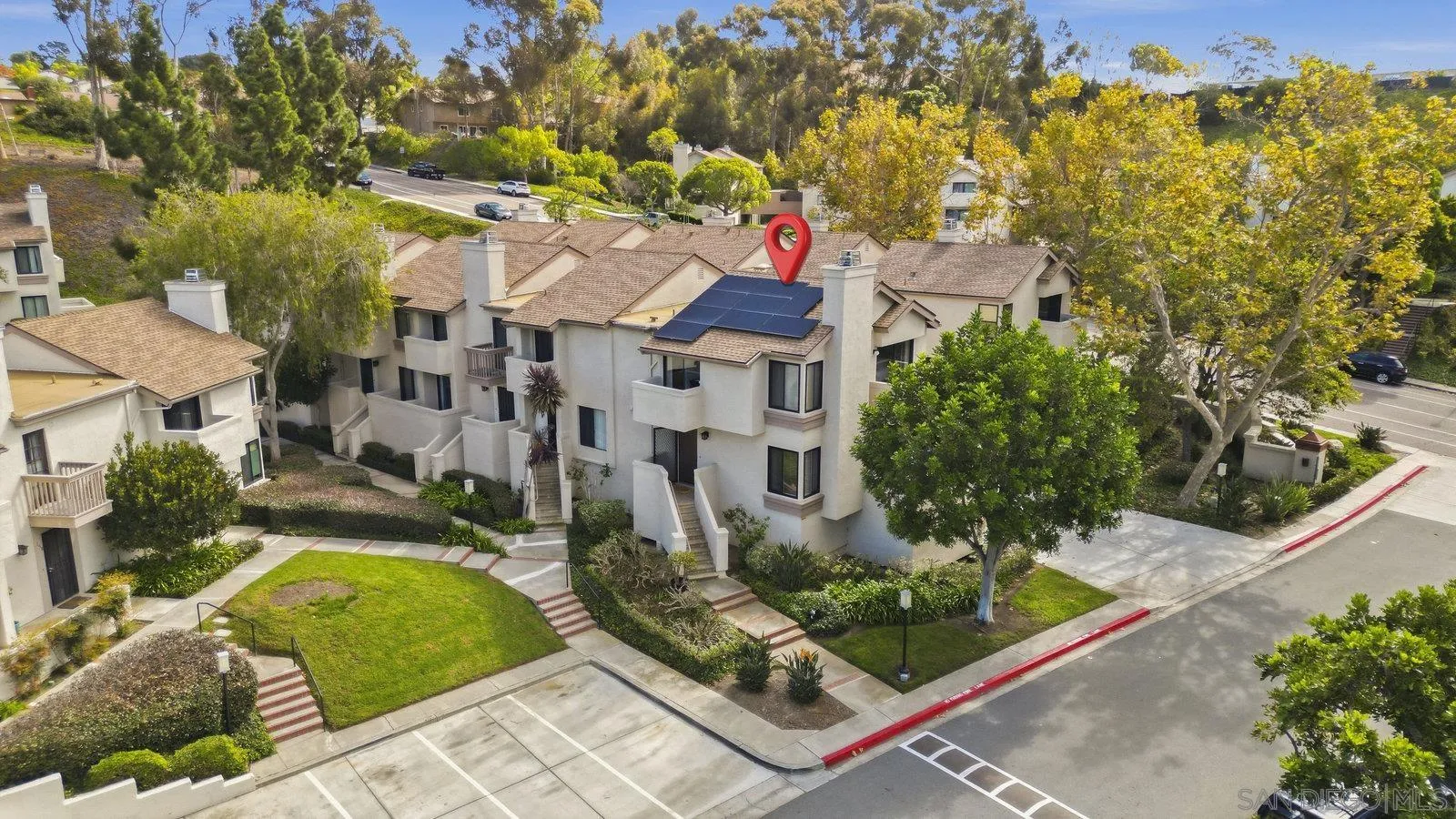2742 Ariane Drive, Unit 153 San Diego, CA 92117 - Photo 2 of 43 front view of a house with a yard