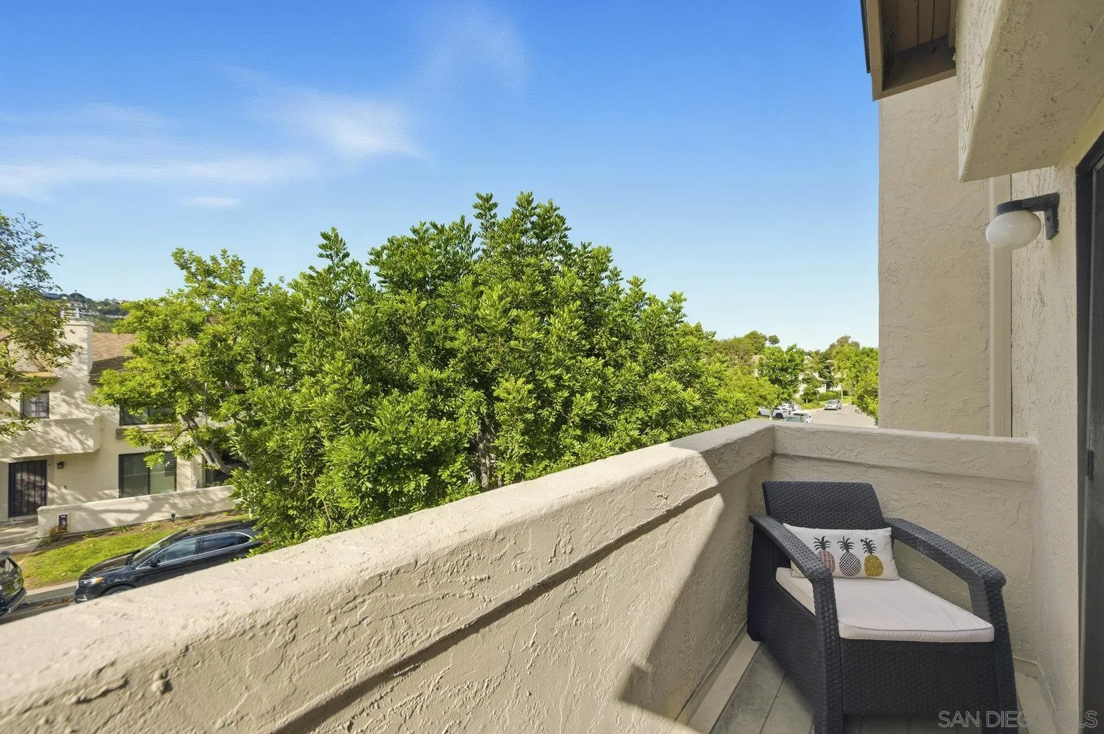 2742 Ariane Drive, Unit 153 San Diego, CA 92117 - Photo 24 of 43 a balcony with table and chairs
