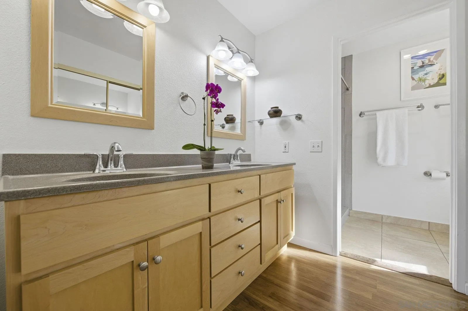 2742 Ariane Drive, Unit 153 San Diego, CA 92117 - Photo 25 of 43 a bathroom with a double vanity sink mirror and shower