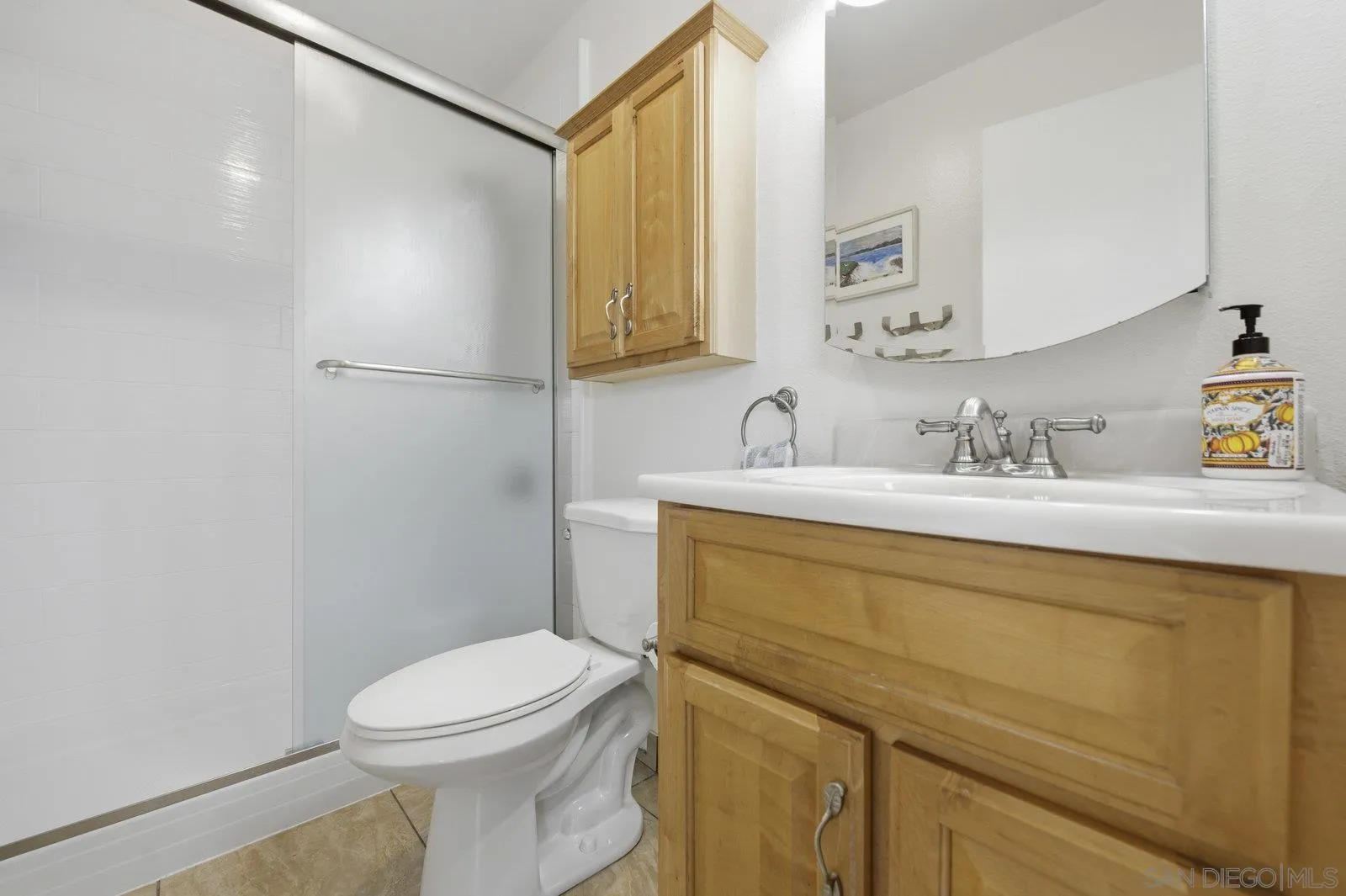 2742 Ariane Drive, Unit 153 San Diego, CA 92117 - Photo 29 of 43 a bathroom with a sink a mirror and a toilet